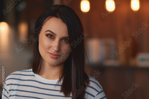 Close up portrait brunette girl at home