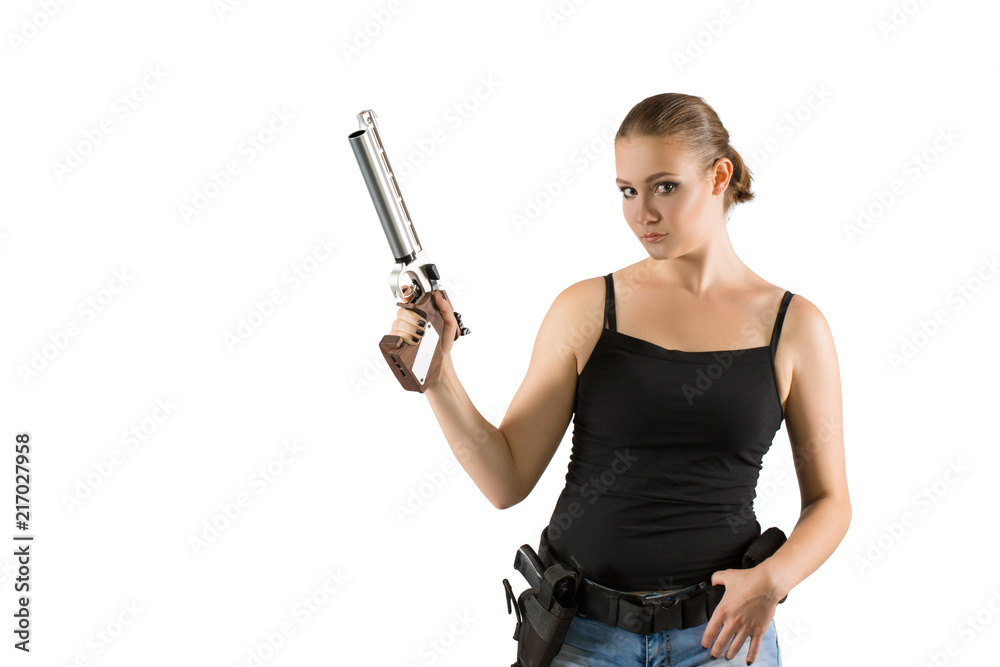 Young beautiful woman holding a gun on white background