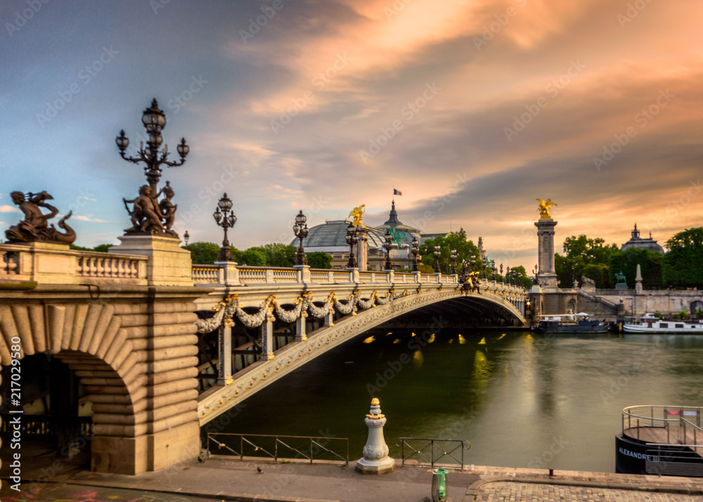 Ponte de alexandre bridge in paris france during sunrise with golden light