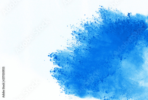 Blue powder explosion on white background. Colored cloud. Color dust explode. Paint Holi. © wooddy7