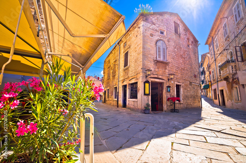Sunny stone street of ancient Pula view