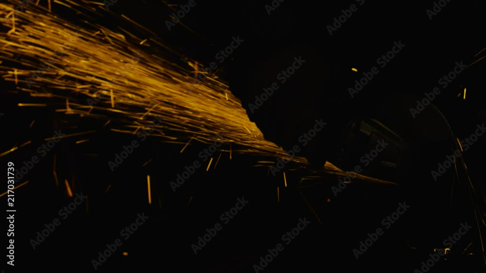 sparks effect - worker cutting iron