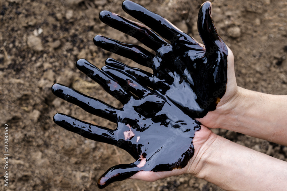 oil leaking. Very dirty hand.Stain hands showing thumbs up with black