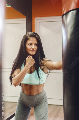 Girl punching bag at gym © focusandblur