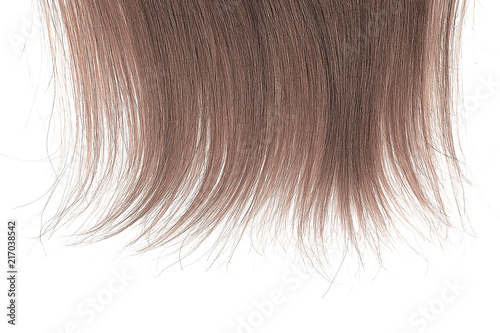 Tips of brown hair on white background
