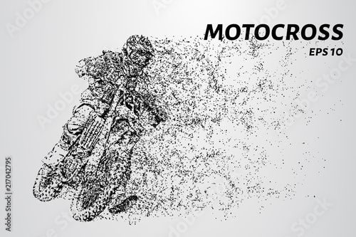 Motocross particles. A motorcyclist performs stunts