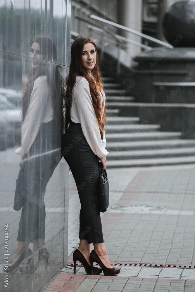 Portrait of a business woman in city streets Portrait of a business woman in city streets
