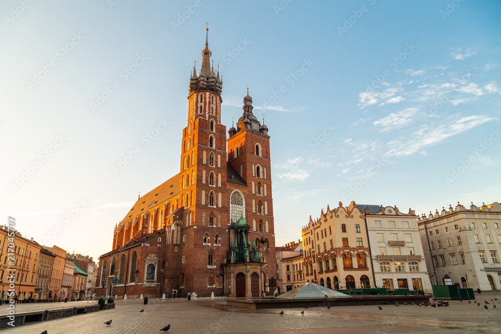 St. Mary's Basilica in Krakow, Poland, famous brick church with two towers, located on the market square in the historic centre at sunrise.