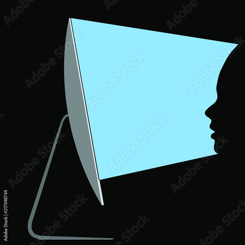 Woman exposed to a unhealthy blue light coming from a screen of her computer.