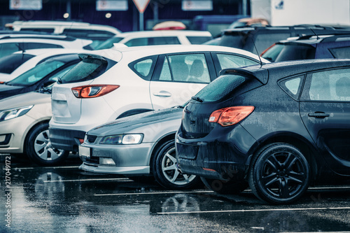 Wet Used Cars on a Parking Lot During Rain © Grigory Bruev
