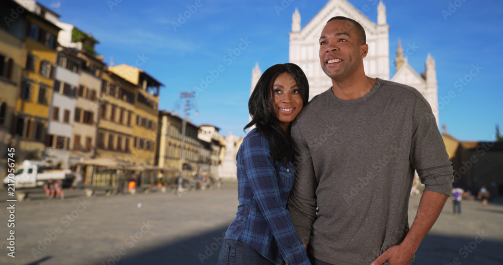 Youthful loving African-American male and female exploring Florence Italy