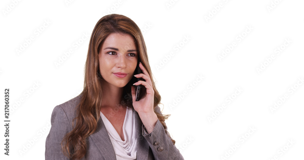 Portrait of professional white female having chat on phone on white background Portrait of professional white female having chat on phone on white background