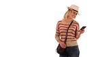 Portrait of happy blonde female hipster using phone on solid white copy space