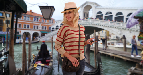 Stylish white hipster girl out sightseeing while vacationing in Venice Italy © rocketclips