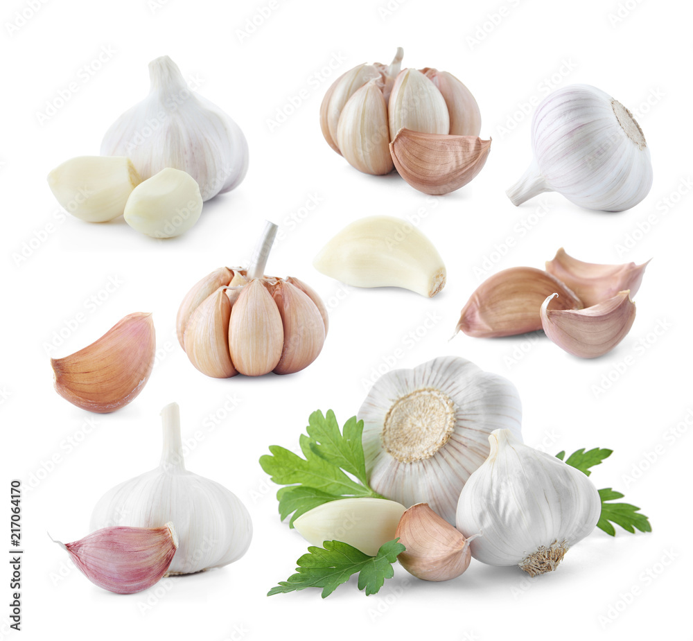 Fototapeta premium Set of different garlic bulbs and cloves on white background