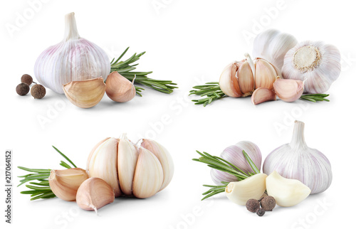 Set of different garlic bulbs and cloves on white background