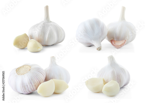 Set of different garlic bulbs and cloves on white background