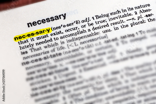 the word NECESSARY highlighted with definition in an English dictionary