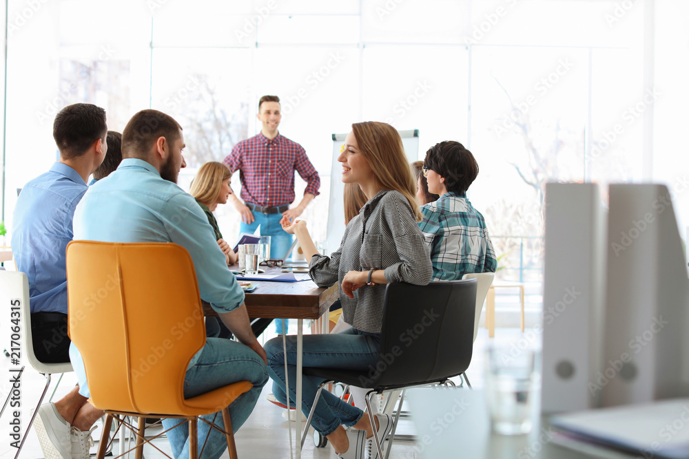 Male business trainer giving lecture in office