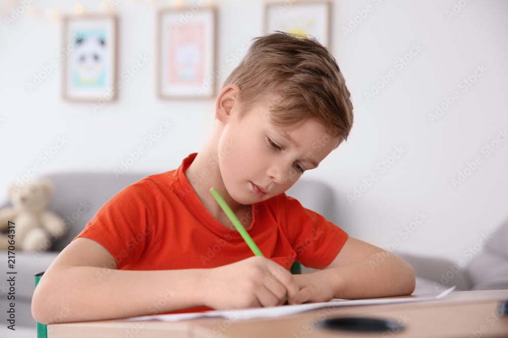 Little boy with autistic disorder drawing at home Little boy with autistic disorder drawing at home