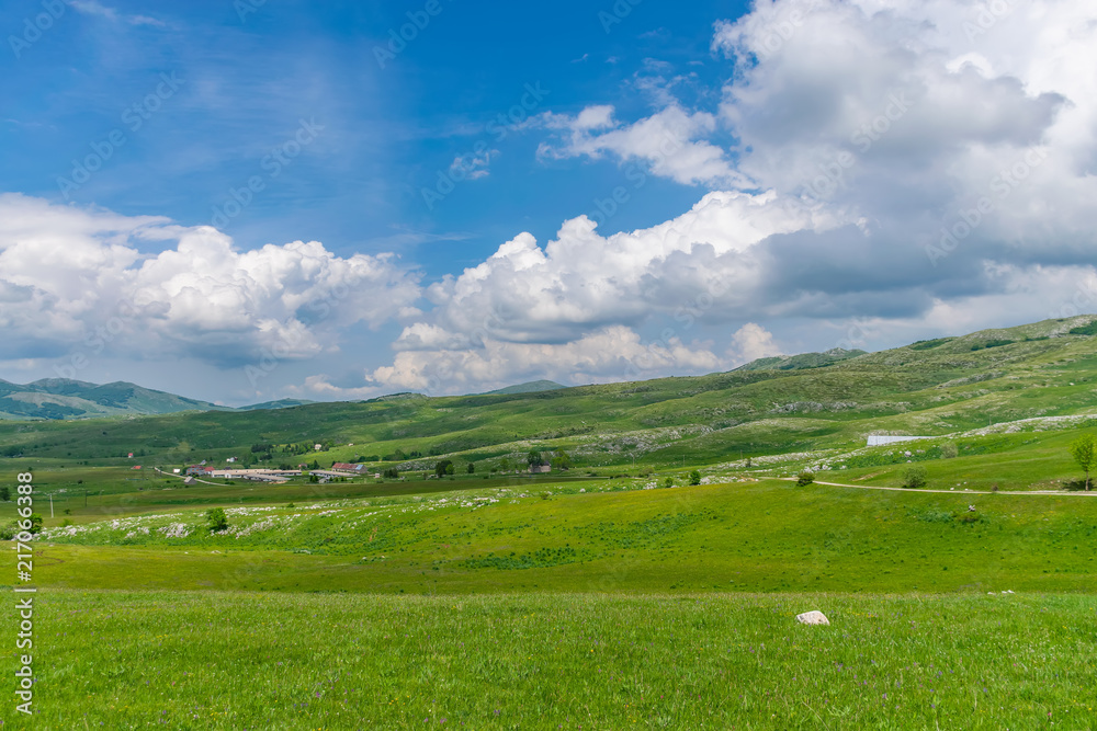 The picturesque village is among the meadows on the high mountains. The picturesque village is among the meadows on the high mountains.