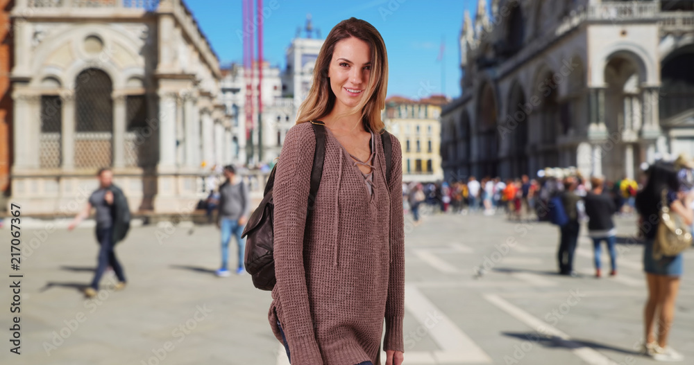 Smiling portrait of young woman on vacation in Venice 