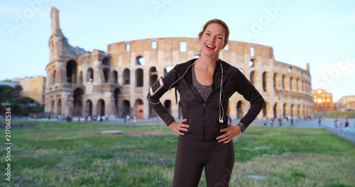 Canvas Print Portrait of healthy woman jogger in Rome smiling directly at camera
