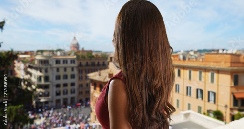 Happy attractive woman tourist looking at cityscape background in Rome Italy