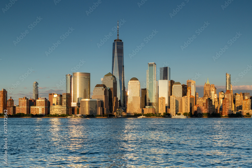 Obraz premium New York City / USA - JUL 18 2018: Financial District buildings facade in Lower Manhattan at sunset