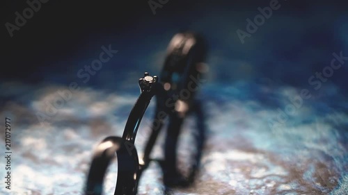 Wedding rings rotating from left to right with light works photo