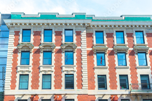 An old historical building with the large windows in Montreal downtown, Canada