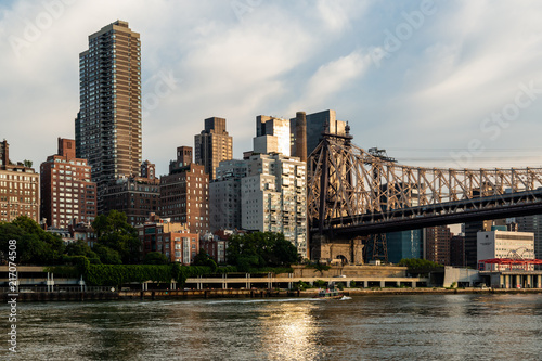 New York City   USA - JUL 31 2018  Queensboro Bridge and midtown view from Roosevelt Island in the early morning