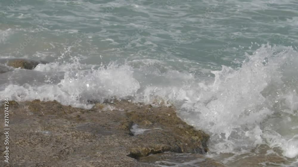 Waves hitting rocks in 180fps slow motion Waves hitting rocks in 180fps slow motion