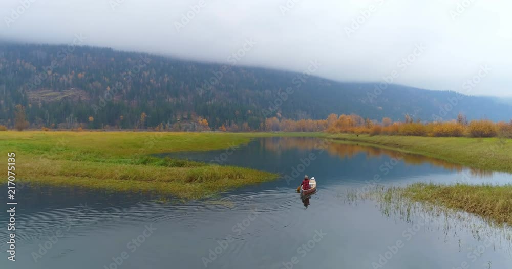 Man rowing a boat on a lake 4k Man rowing a boat on a lake 4k