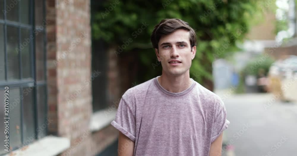 Portrait of millennial male outdoors on street Portrait of millennial male outdoors on street
