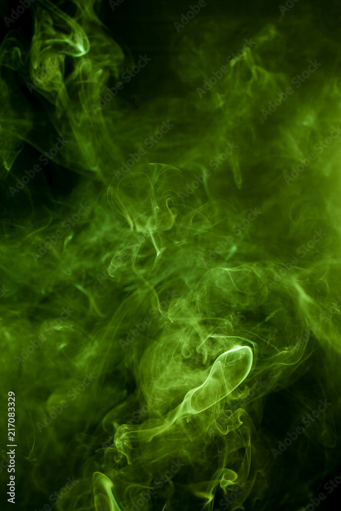 Green smoke on a black background. smoke on a black background. Green smoke on a black background. smoke on a black background.