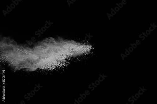 White powder explosion on white background. Colored cloud. Colorful dust explode. Paint Holi.