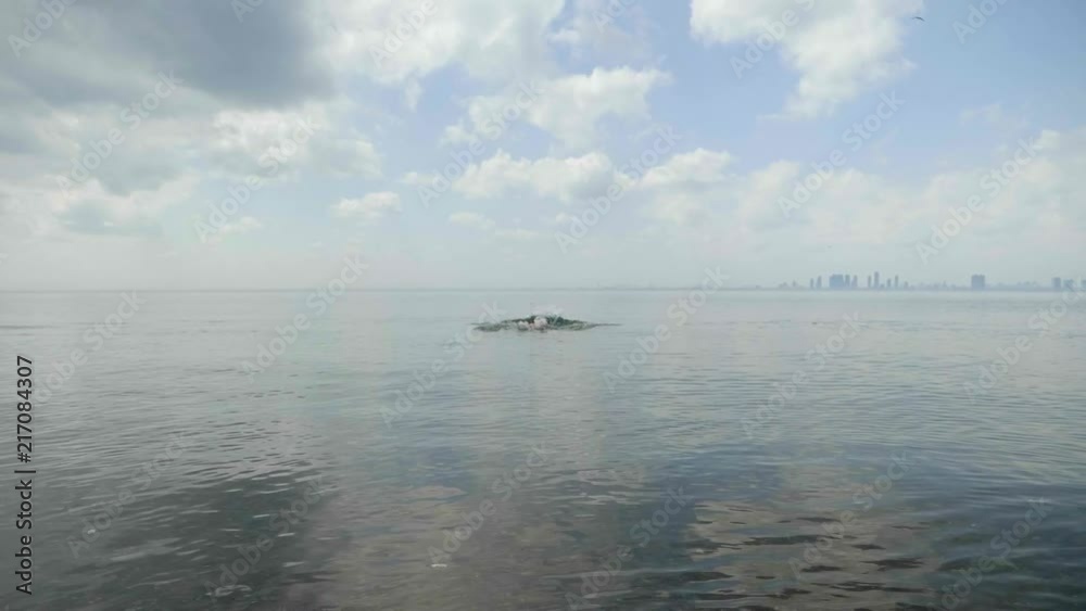 Back of a guy going in the lake Back of a guy going in the lake