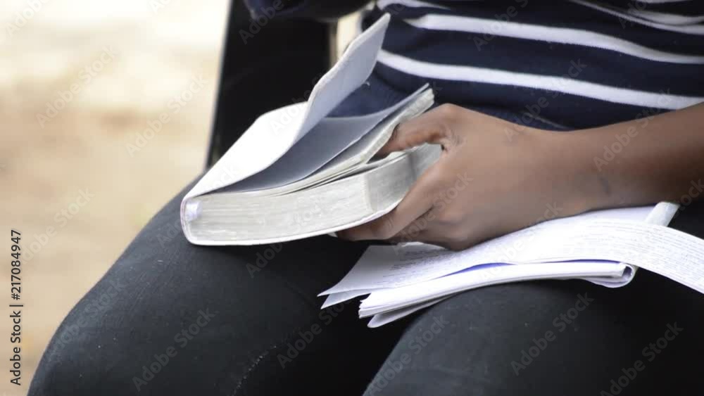 Opening bible on lap