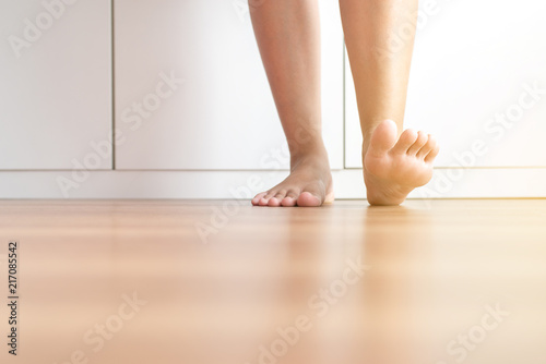 Barefoot asian woman clean and solf skin on the wooden floor