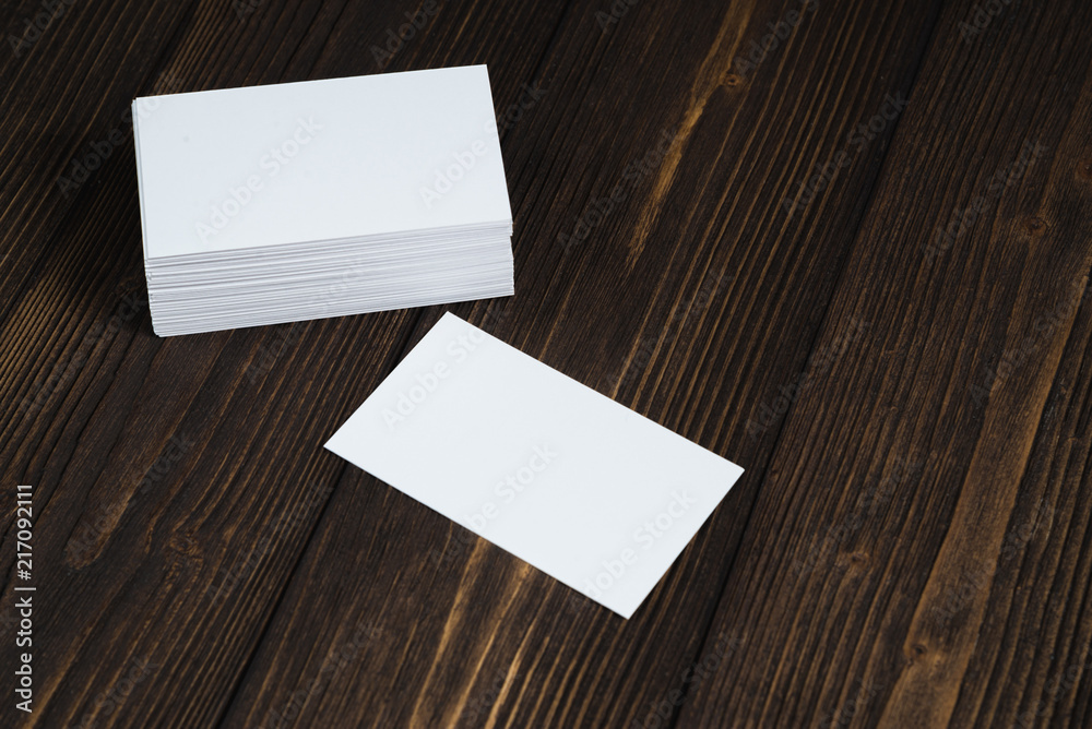 Blank business cards on wooden working table with copy space for add text ID. and logo, business company concept. Blank business cards on wooden working table with copy space for add text ID. and logo, business company concept.