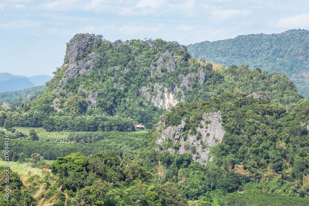 High angle landscape view over rainforest  limestone mountains from Phu Pa Por view point at Loei province ,Thailand .