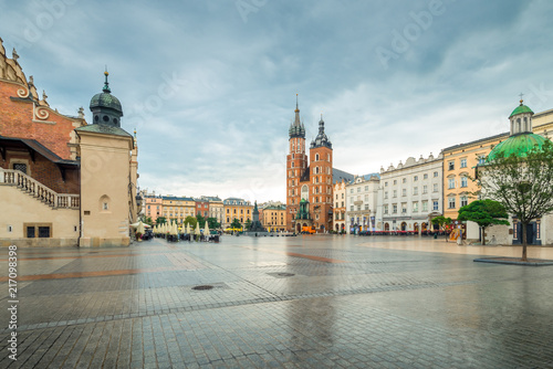 A rainy day in Krakow, a view of the main square of the city and the church of Mariacki