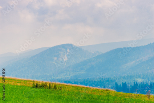 expanses - a beautiful landscape of the field, mountains, forests in the haze