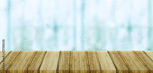 Empty wood table top on white bokeh abstract background. photo. Abstract blur empty modern background in with wooden floor