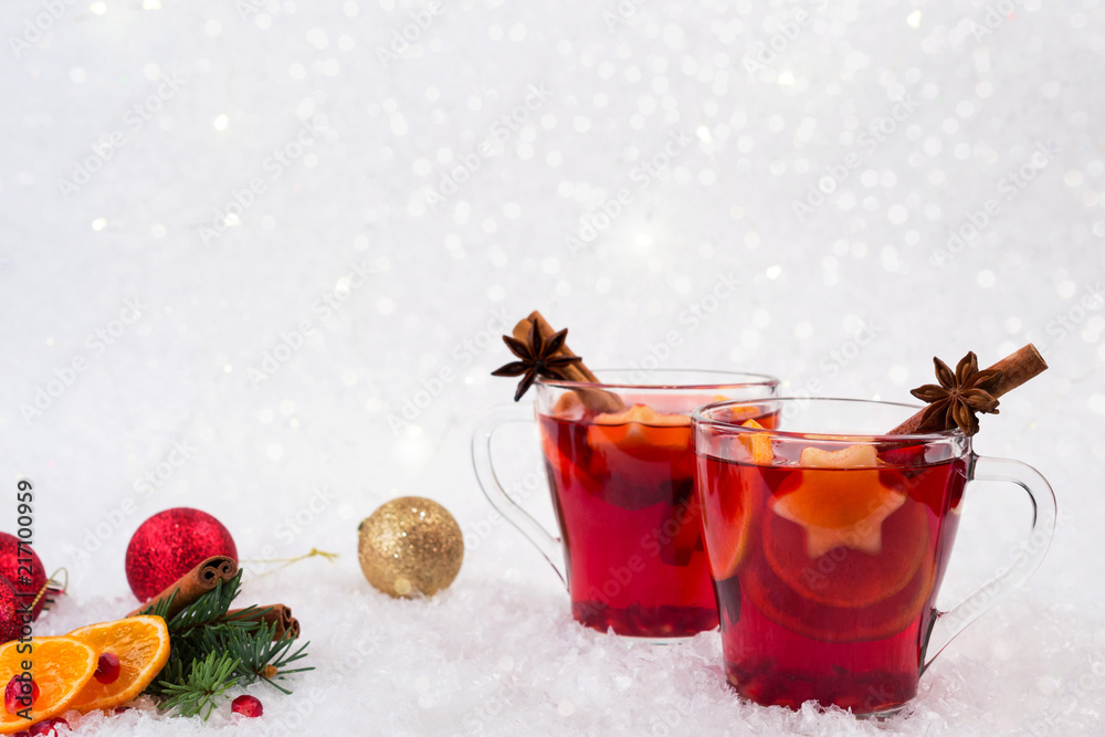 Christmas mulled wine and ingredients. On white snow background with copyspace Christmas mulled wine and ingredients. On white snow background with copyspace