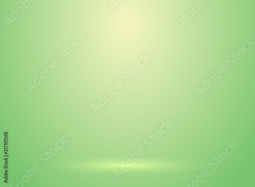 Studio room green lihjt background with lighting well use as Business backdrop photo