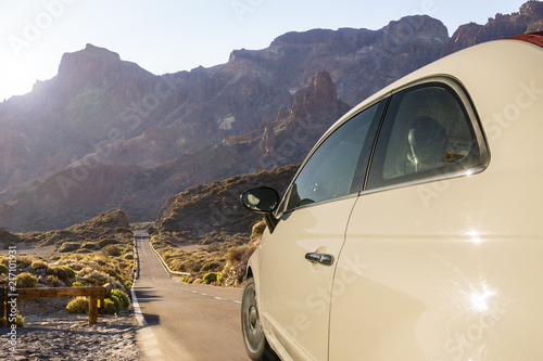 car driving along a desert road