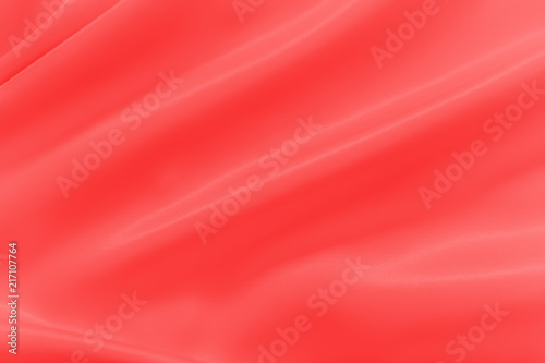 Smooth elegant shiny red silk or satin luxury cloth texture can use as abstract holidays background. Luxurious Christmas background or New Year background design.