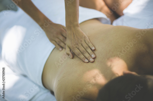 Women massage young men.